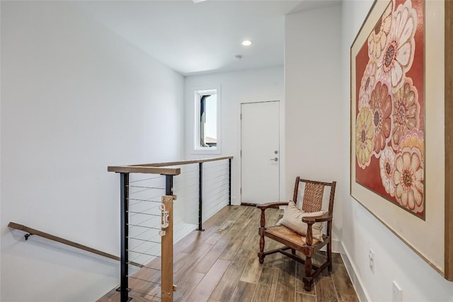 4609 Unity Cir, Austin, TX 78731 - hall with wood finished floors, an upstairs landing, baseboards, and recessed lighting