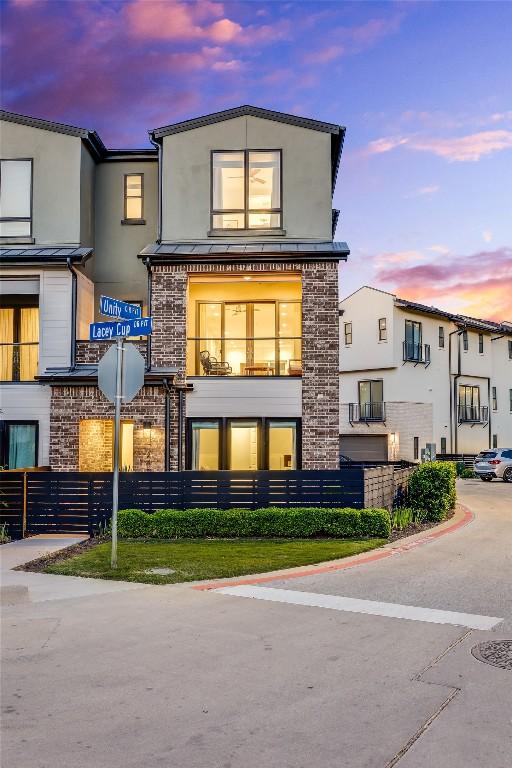 4609 Unity Cir, Austin, TX 78731 - back of house at dusk with stucco siding
