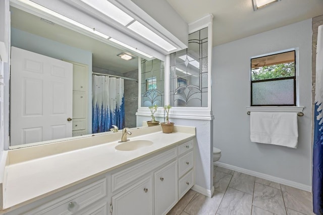 315 Juniper Dr, Mountain City, TX 78610 - bathroom featuring toilet, marble look tile flooring, vanity, baseboards, and a shower with shower curtain