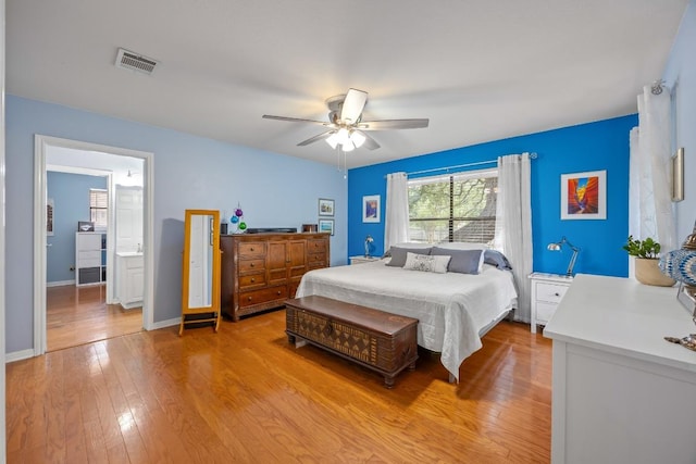 315 Juniper Dr, Mountain City, TX 78610 - bedroom featuring light wood finished floors, a ceiling fan, and baseboards