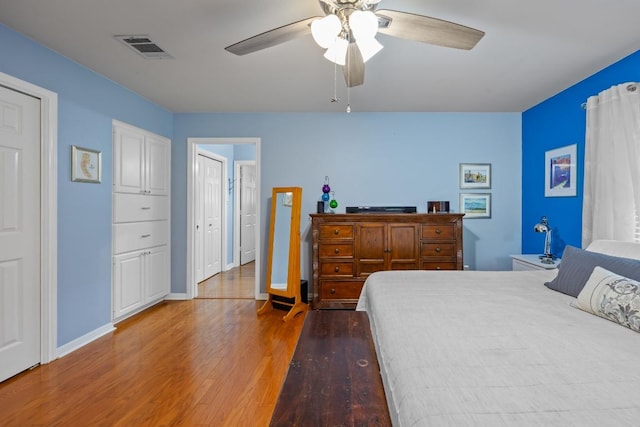 315 Juniper Dr, Mountain City, TX 78610 - bedroom with wood finished floors, baseboards, and a ceiling fan