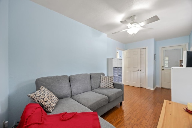 315 Juniper Dr, Mountain City, TX 78610 - living room featuring hardwood / wood-style flooring, ceiling fan, and baseboards