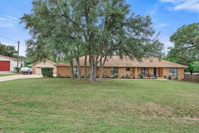 315 Juniper Dr, Mountain City, TX 78610 - single story home featuring brick siding and concrete driveway