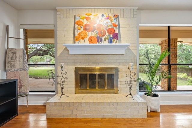 315 Juniper Dr, Mountain City, TX 78610 - living room with hardwood / wood-style floors, a fireplace, and baseboards
