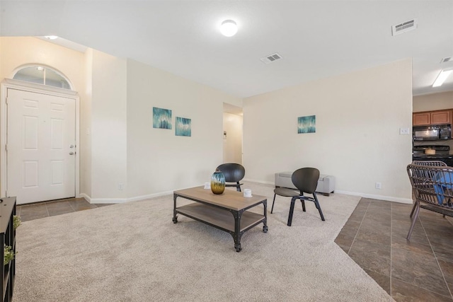 living room featuring baseboards and tile patterned floors