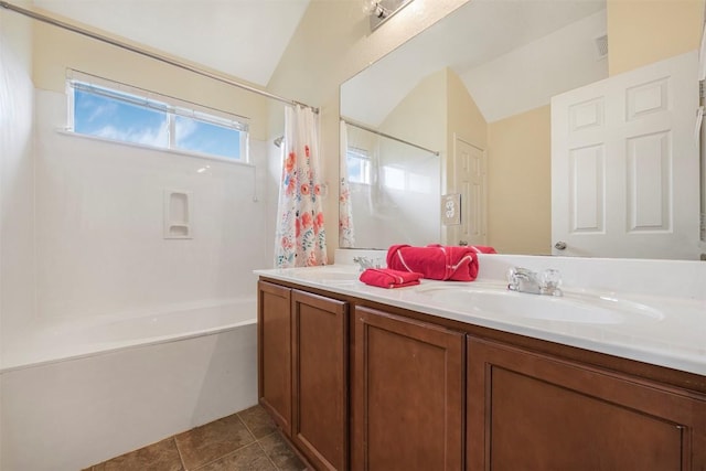 217 Teron Dr, San Marcos, TX 78666 - full bath with lofted ceiling, shower / bathtub combination with curtain, and double vanity