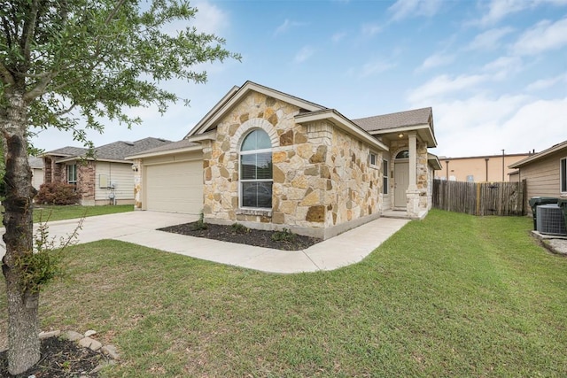 ranch-style house with stone siding, driveway, an attached garage, and central AC