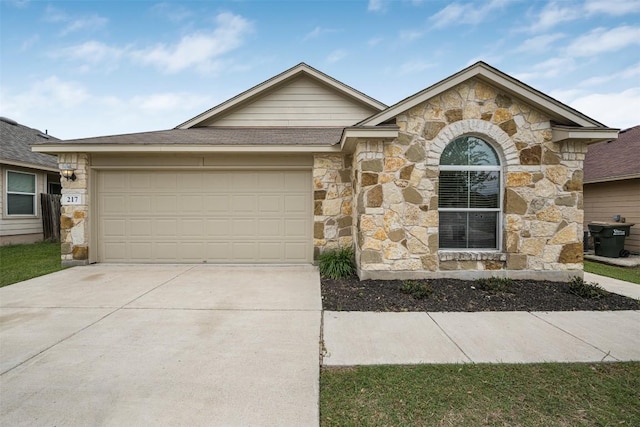 single story home featuring stone siding, an attached garage, driveway, and roof with shingles