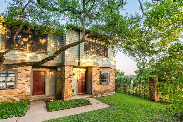 7122 Wood Hollow Dr Unit 13, Austin, TX 78731 - view of front of property with brick siding