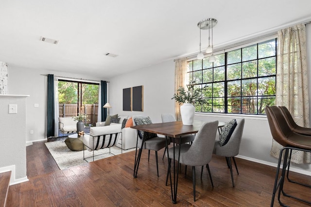 7122 Wood Hollow Dr Unit 13, Austin, TX 78731 - dining room with wood finished floors and baseboards