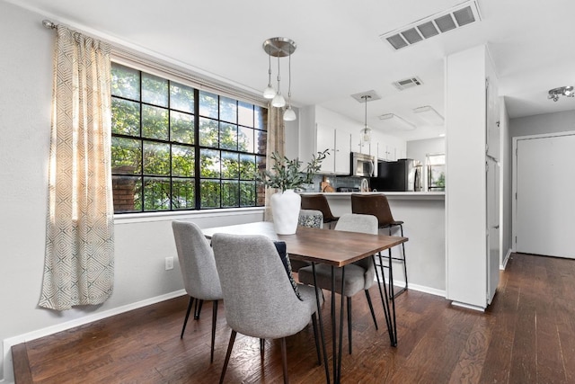 7122 Wood Hollow Dr Unit 13, Austin, TX 78731 - dining room with dark wood-style floors