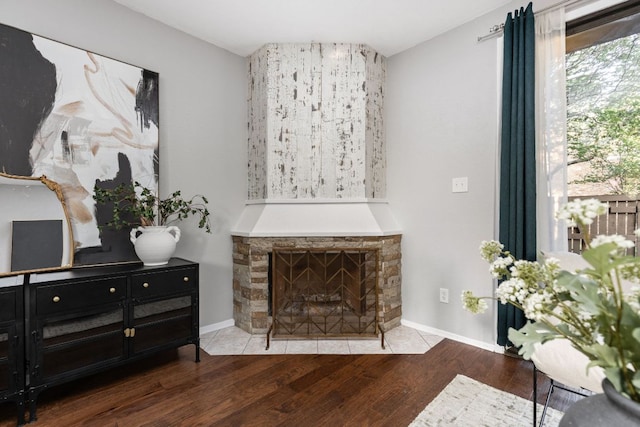 7122 Wood Hollow Dr Unit 13, Austin, TX 78731 - living room with wood finished floors and a stone fireplace