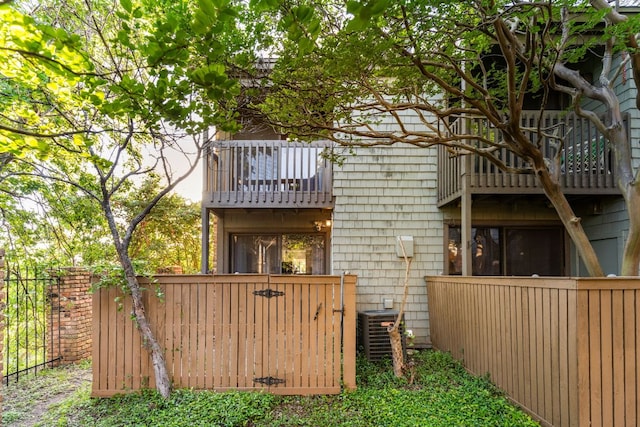 7122 Wood Hollow Dr Unit 13, Austin, TX 78731 - rear view of property with a balcony