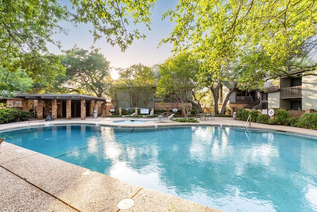 7122 Wood Hollow Dr Unit 13, Austin, TX 78731 - community pool with a community hot tub and a patio area