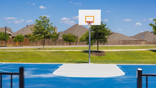 view of sport court with basketball hoop