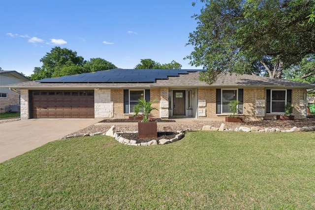 531 Dennis Dr, Round Rock, TX 78664 - single story home featuring a garage, roof mounted solar panels, a front lawn, concrete driveway, and brick siding