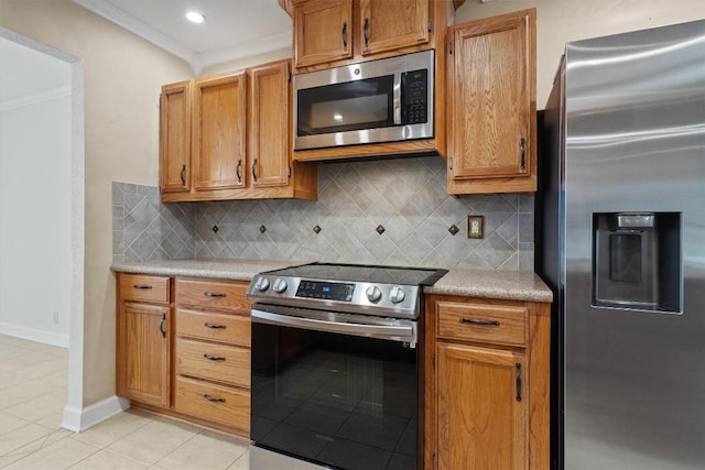 531 Dennis Dr, Round Rock, TX 78664 - kitchen with appliances with stainless steel finishes, crown molding, light tile patterned floors, light countertops, and backsplash