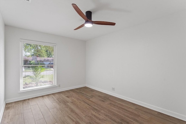 531 Dennis Dr, Round Rock, TX 78664 - unfurnished room with wood finished floors, baseboards, and ceiling fan