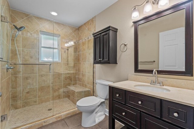531 Dennis Dr, Round Rock, TX 78664 - full bath with tile patterned floors, a stall shower, vanity, and toilet