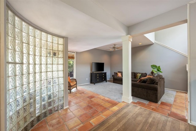 5900 Nasco Dr, Austin, TX 78757 - living area featuring decorative columns, a ceiling fan, and baseboards