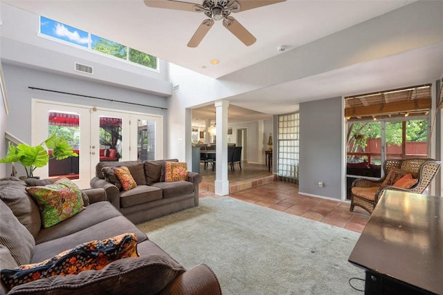 5900 Nasco Dr, Austin, TX 78757 - tiled living area with ornate columns, a ceiling fan, and plenty of natural light