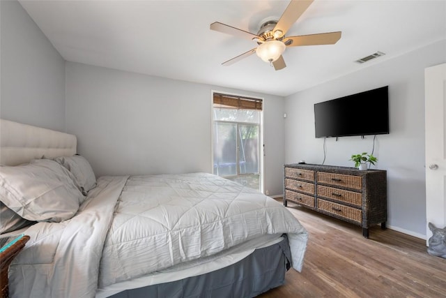 5900 Nasco Dr, Austin, TX 78757 - bedroom featuring wood finished floors, ceiling fan, and baseboards