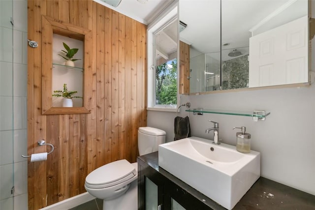 5900 Nasco Dr, Austin, TX 78757 - full bath with toilet, a shower, vanity, and wood walls