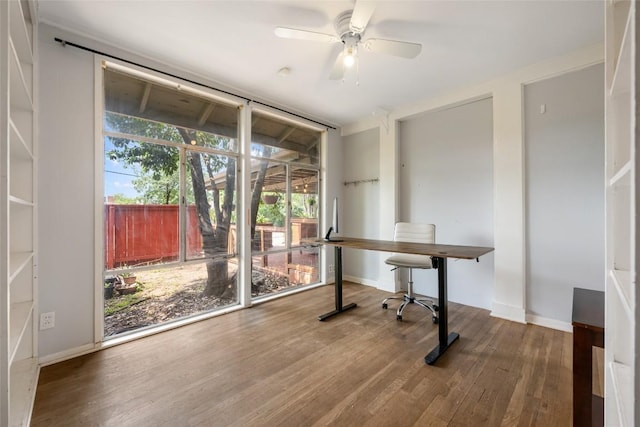 5900 Nasco Dr, Austin, TX 78757 - unfurnished office featuring wood finished floors, a ceiling fan, baseboards, and expansive windows