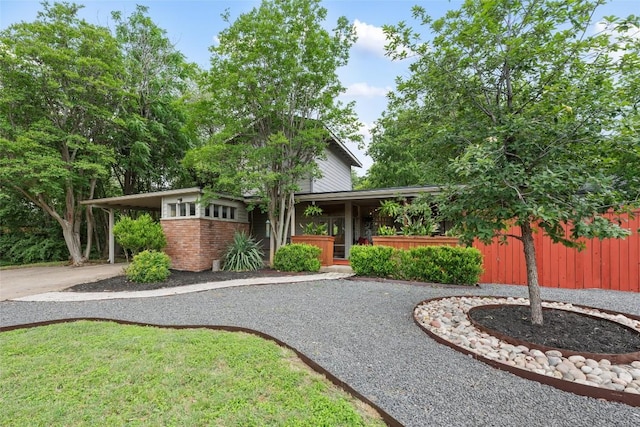 5900 Nasco Dr, Austin, TX 78757 - view of front of property featuring driveway and brick siding
