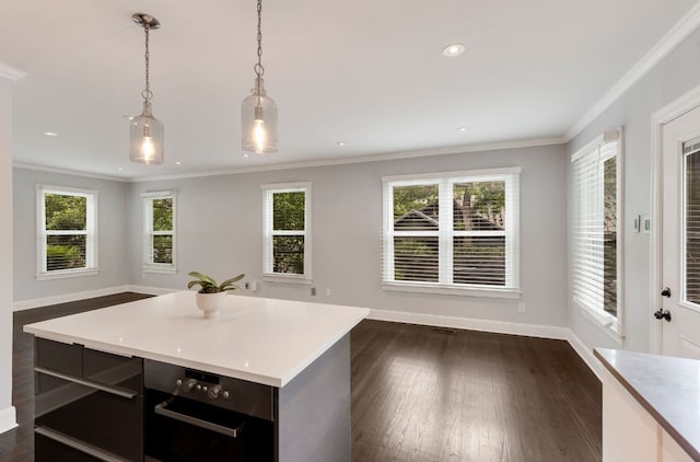 701 Bouldin Ave, Austin, TX 78704 - kitchen with light countertops, healthy amount of natural light, crown molding, and recessed lighting