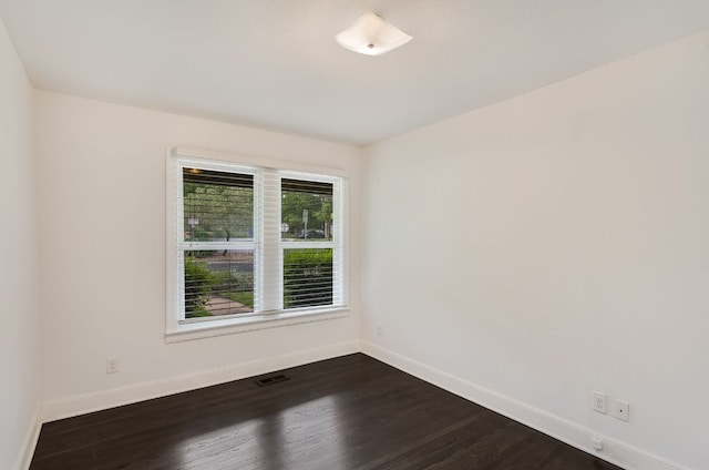 701 Bouldin Ave, Austin, TX 78704 - unfurnished room featuring baseboards and dark wood-style floors