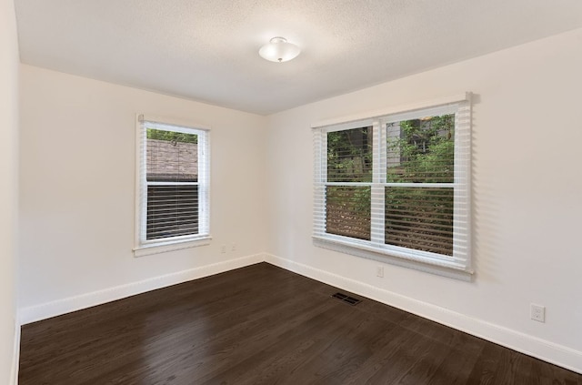 701 Bouldin Ave, Austin, TX 78704 - empty room featuring dark wood-type flooring and baseboards