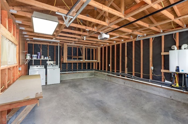 701 Bouldin Ave, Austin, TX 78704 - garage featuring washing machine and dryer and tankless water heater