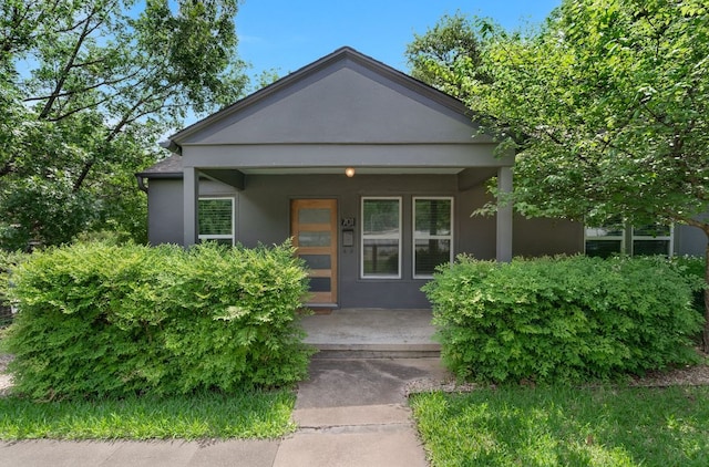 701 Bouldin Ave, Austin, TX 78704 - view of front of home with a porch and stucco siding