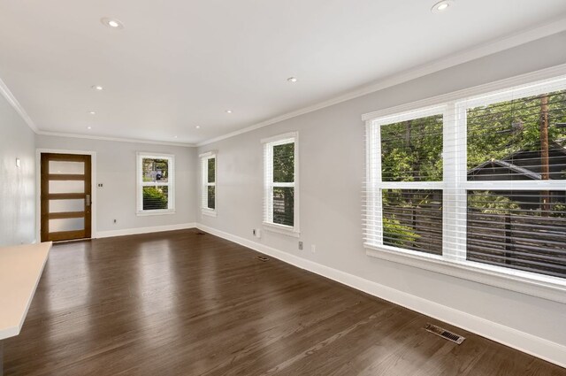 701 Bouldin Ave, Austin, TX 78704 - spare room with ornamental molding, dark wood-type flooring, baseboards, and recessed lighting
