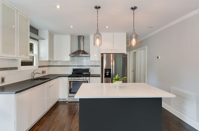 701 Bouldin Ave, Austin, TX 78704 - kitchen featuring wall chimney exhaust hood, stainless steel appliances, a sink, decorative backsplash, and crown molding