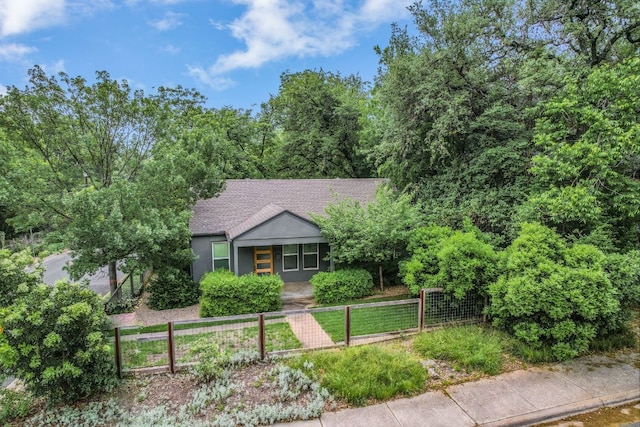 701 Bouldin Ave, Austin, TX 78704 - view of front of home with a fenced front yard and a shingled roof