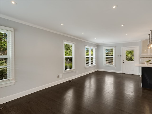 701 Bouldin Ave, Austin, TX 78704 - unfurnished living room with dark wood finished floors, crown molding, recessed lighting, and a chandelier