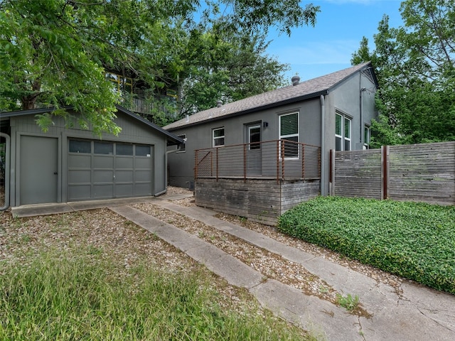 701 Bouldin Ave, Austin, TX 78704 - single story home featuring an outbuilding, a garage, a shingled roof, and stucco siding