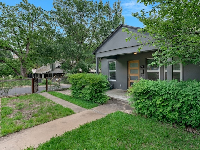 701 Bouldin Ave, Austin, TX 78704 - view of front of house featuring stucco siding and a porch