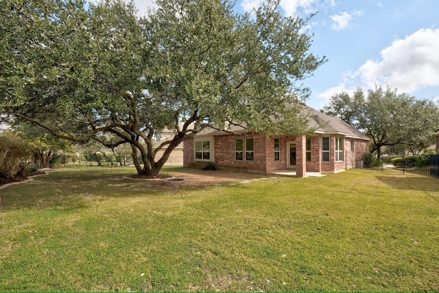 rear view of property with brick siding