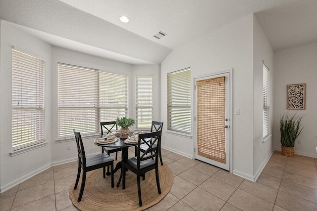 4924 Pyrenees Pass, Bee Cave, TX 78738 - dining space with light tile patterned floors and lofted ceiling