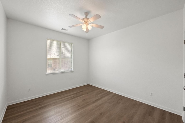 4924 Pyrenees Pass, Bee Cave, TX 78738 - empty room featuring a ceiling fan and dark wood finished floors