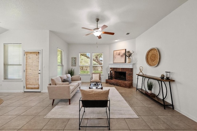4924 Pyrenees Pass, Bee Cave, TX 78738 - living room with light tile patterned floors, ceiling fan, and a fireplace