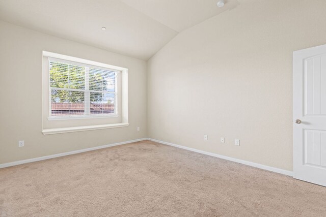 2880 Donnell Dr Unit 3903, Round Rock, TX 78664 - carpeted empty room with lofted ceiling and baseboards
