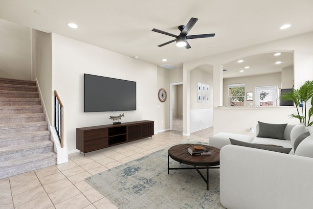 2880 Donnell Dr Unit 3903, Round Rock, TX 78664 - tiled living area featuring stairs, a ceiling fan, recessed lighting, arched walkways, and baseboards