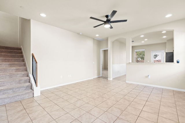 2880 Donnell Dr Unit 3903, Round Rock, TX 78664 - unfurnished living room with a ceiling fan, recessed lighting, stairs, arched walkways, and light tile patterned floors