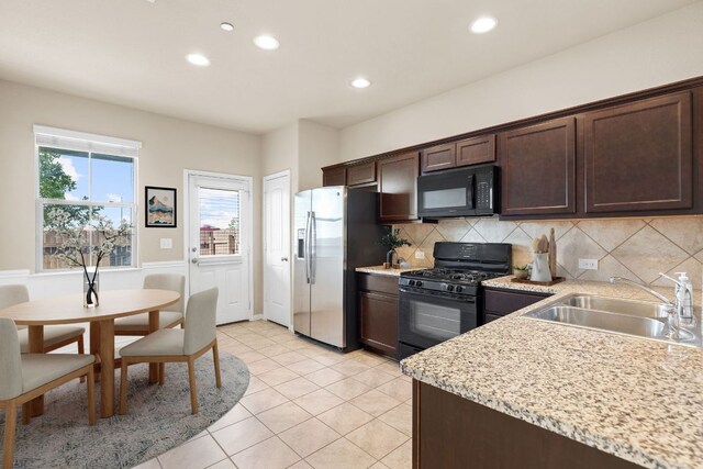 2880 Donnell Dr Unit 3903, Round Rock, TX 78664 - kitchen featuring black appliances, a sink, dark brown cabinetry, recessed lighting, and plenty of natural light