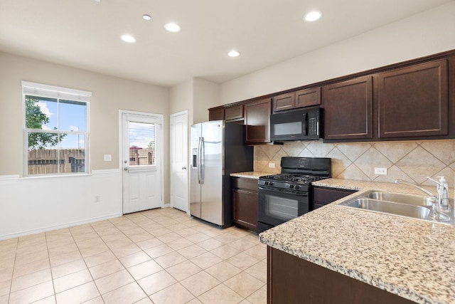 2880 Donnell Dr Unit 3903, Round Rock, TX 78664 - kitchen featuring black appliances, a sink, dark brown cabinets, recessed lighting, and tasteful backsplash