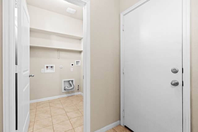 2880 Donnell Dr Unit 3903, Round Rock, TX 78664 - washroom featuring electric dryer hookup, hookup for a gas dryer, hookup for a washing machine, light tile patterned flooring, and baseboards
